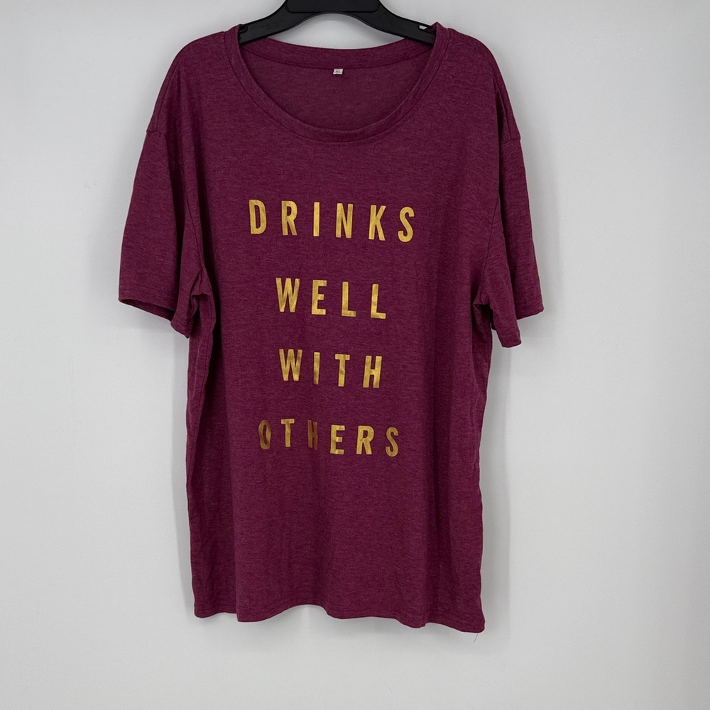 Burgundy Short-Sleeve Tee with Gold Foil Text “Drinks Well With Others” XL